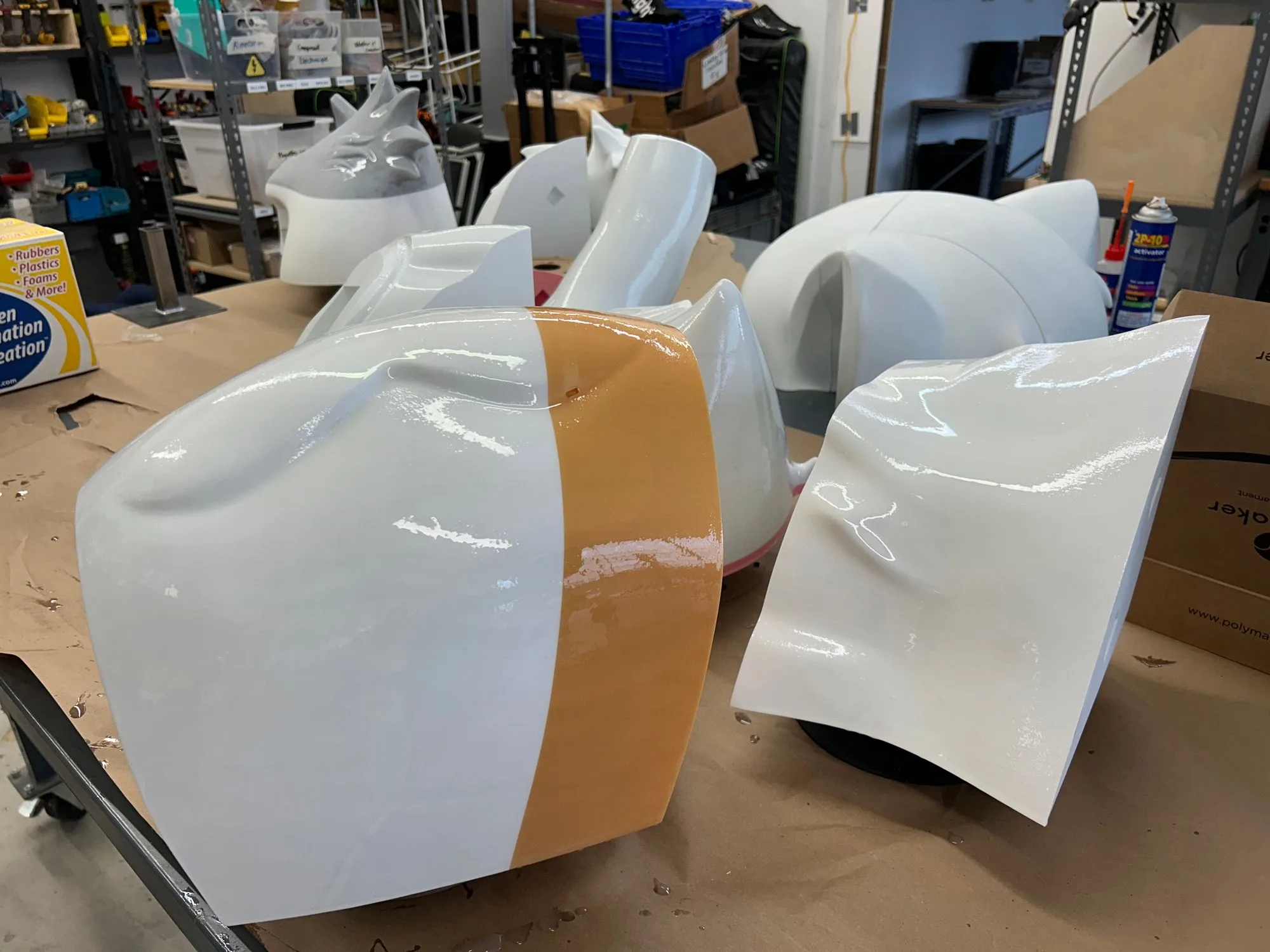 Painted Helios body panels drying in the workshop