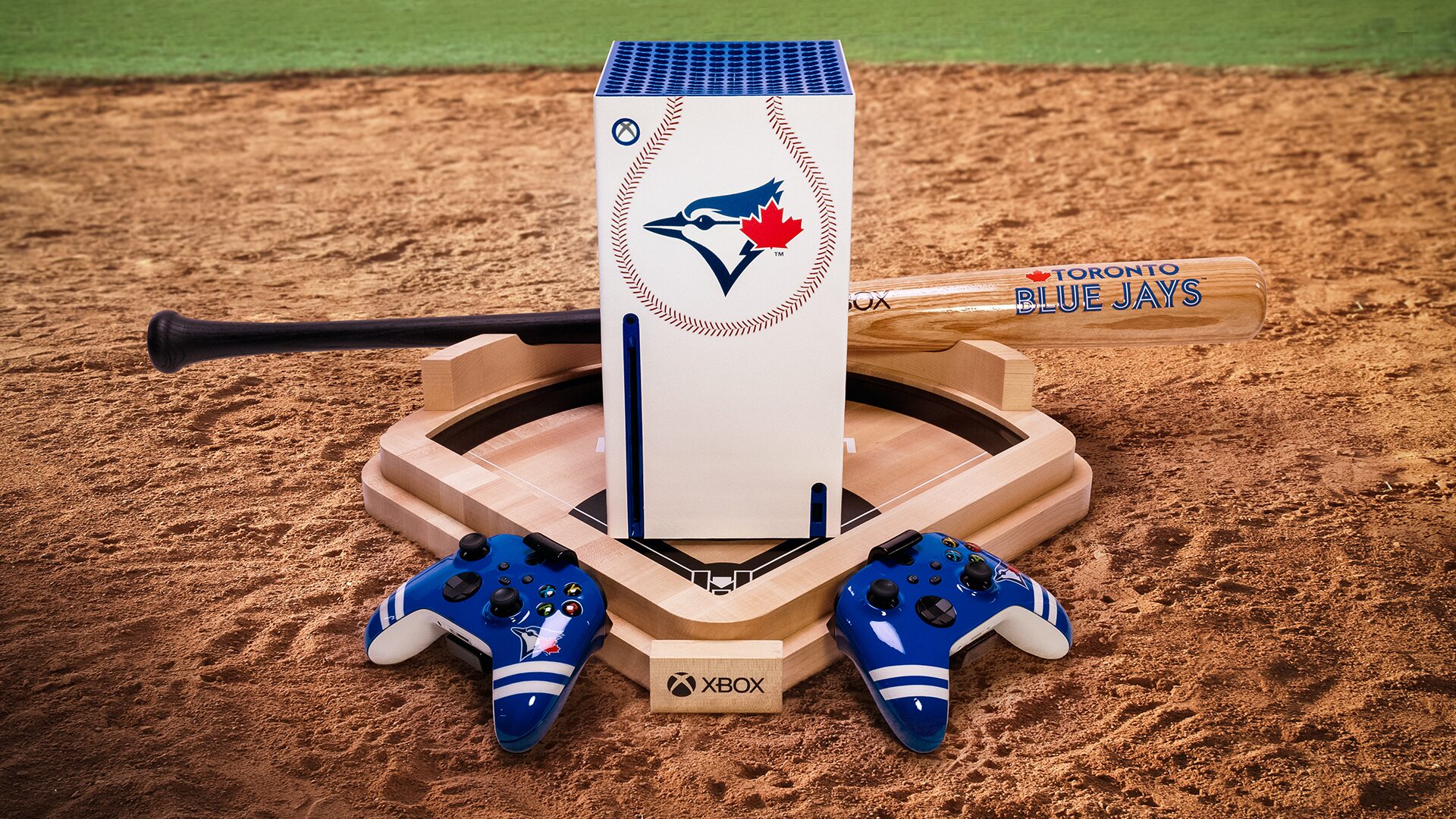 Custom Toronto Blue Jays Xbox Series X with controllers and bat