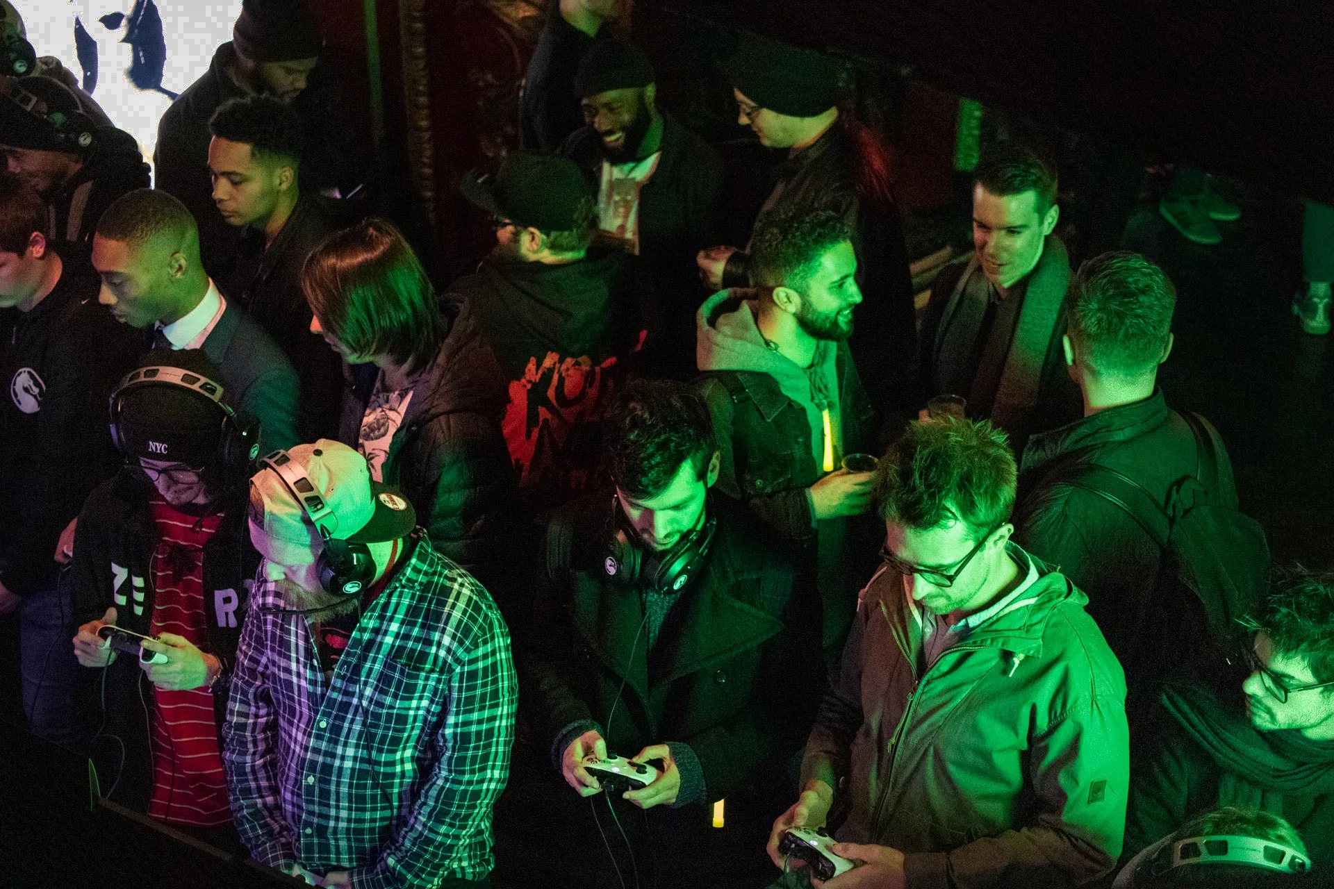 Fans playing Mortal Kombat 11 across the gaming pods at KOKO